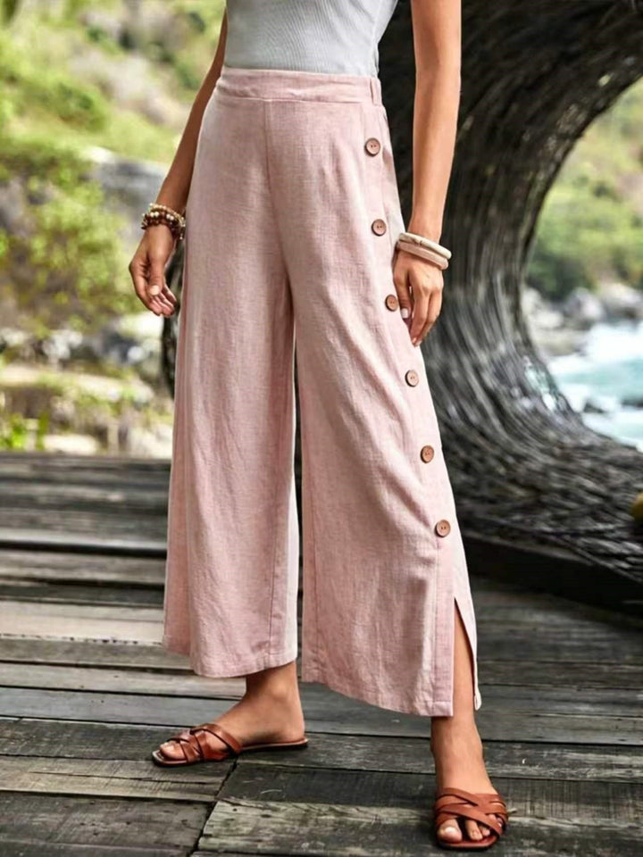 Pantalones de lino de pierna ancha y corte relajado para mujer con detalle de botones