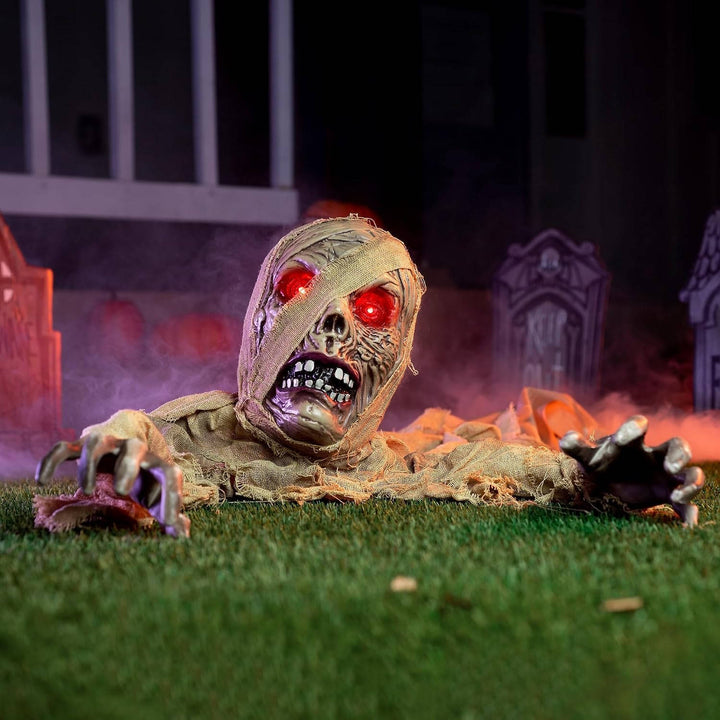 Figura de zombi que emerge del suelo para Halloween, con ojos iluminados y sonido, para mujer
